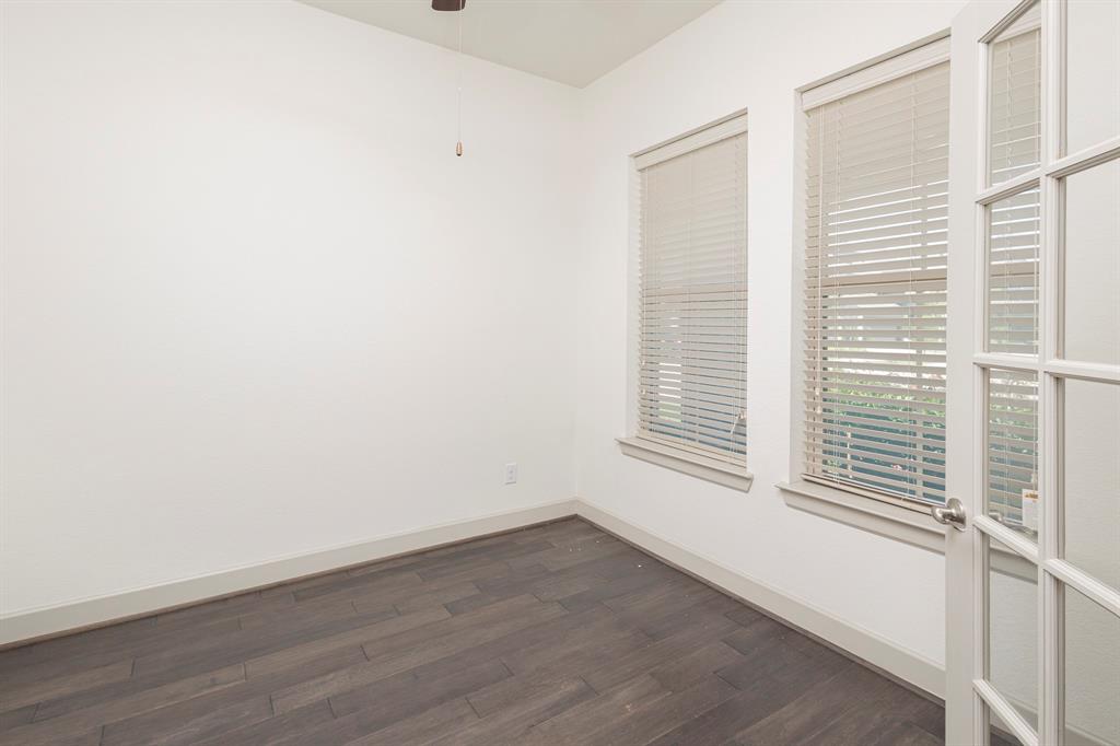 6337 Saddlebrook Way Irving, TX 75039 - Photo 6 of 40 a view of a small space with wooden floor and a window