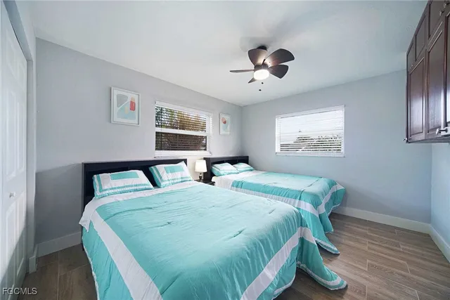 a bed sitting in a bedroom next to a window