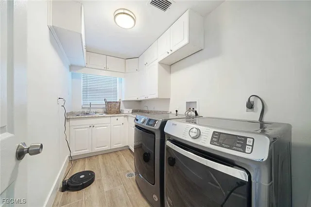 a kitchen with a stove and a sink