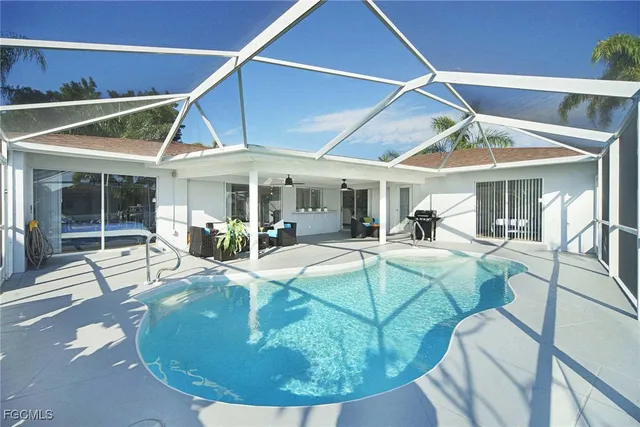 a view of a dining room with furniture floor to ceiling window and potted plants