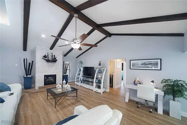 a living room with furniture and a fireplace