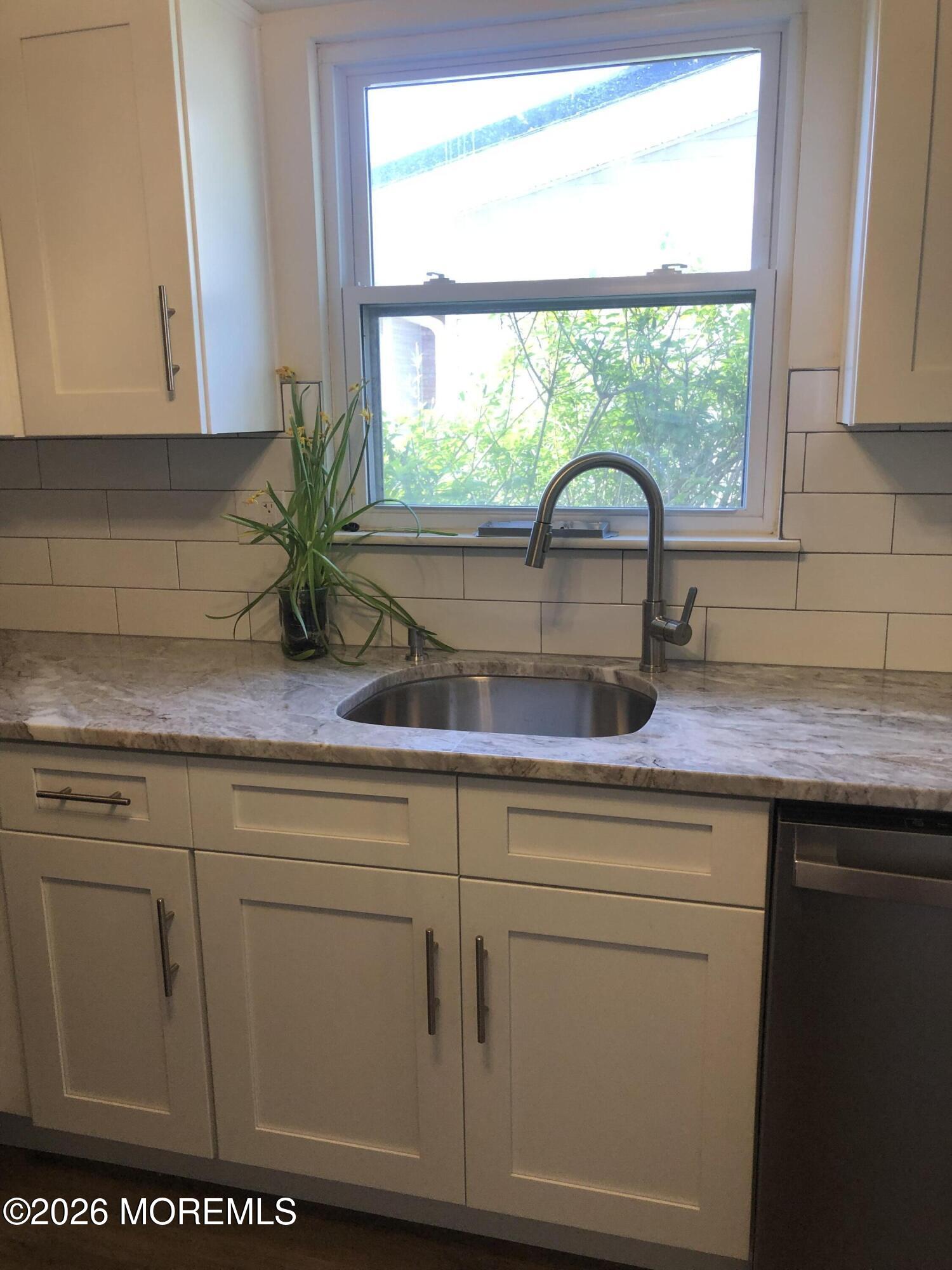 6 Dickinson Road Brick, NJ 08724 - Photo 5 of 17 a kitchen with appliances cabinets and a window