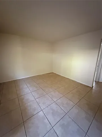 an empty room with white walls