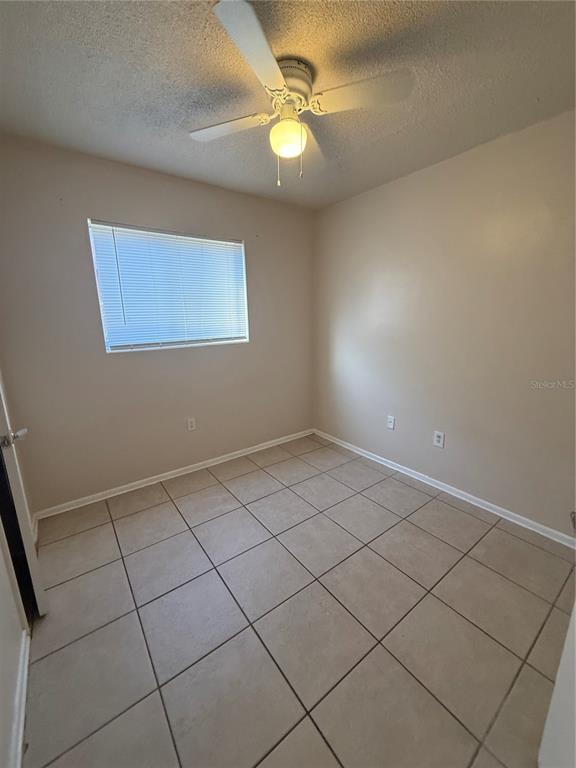 800 North Hastings Street, Unit 5 Orlando, FL 32808 - Photo 9 of 11 a view of an empty room with a window