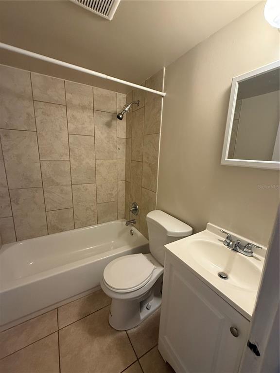 800 North Hastings Street, Unit 5 Orlando, FL 32808 - Photo 10 of 11 a white toilet sitting next to a bath tub