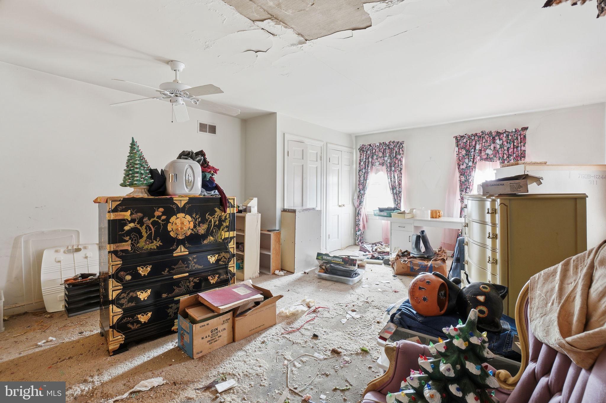 1430 Foxhall Road Northwest Washington, DC 20007 - Photo 15 of 53 a bedroom with furniture and a chandelier