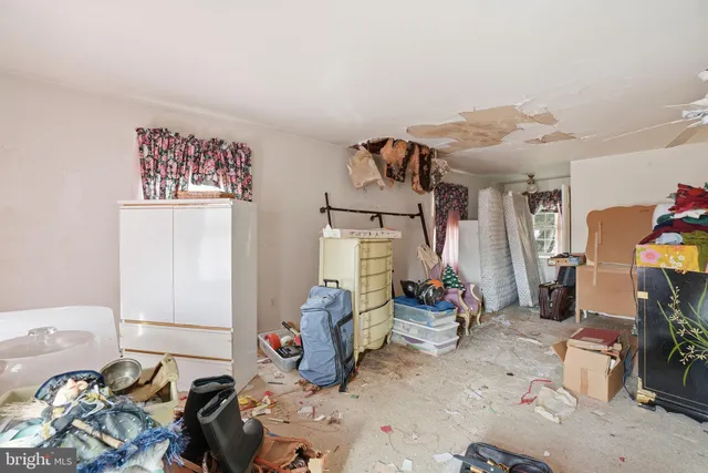 a view of a livingroom with furniture and window