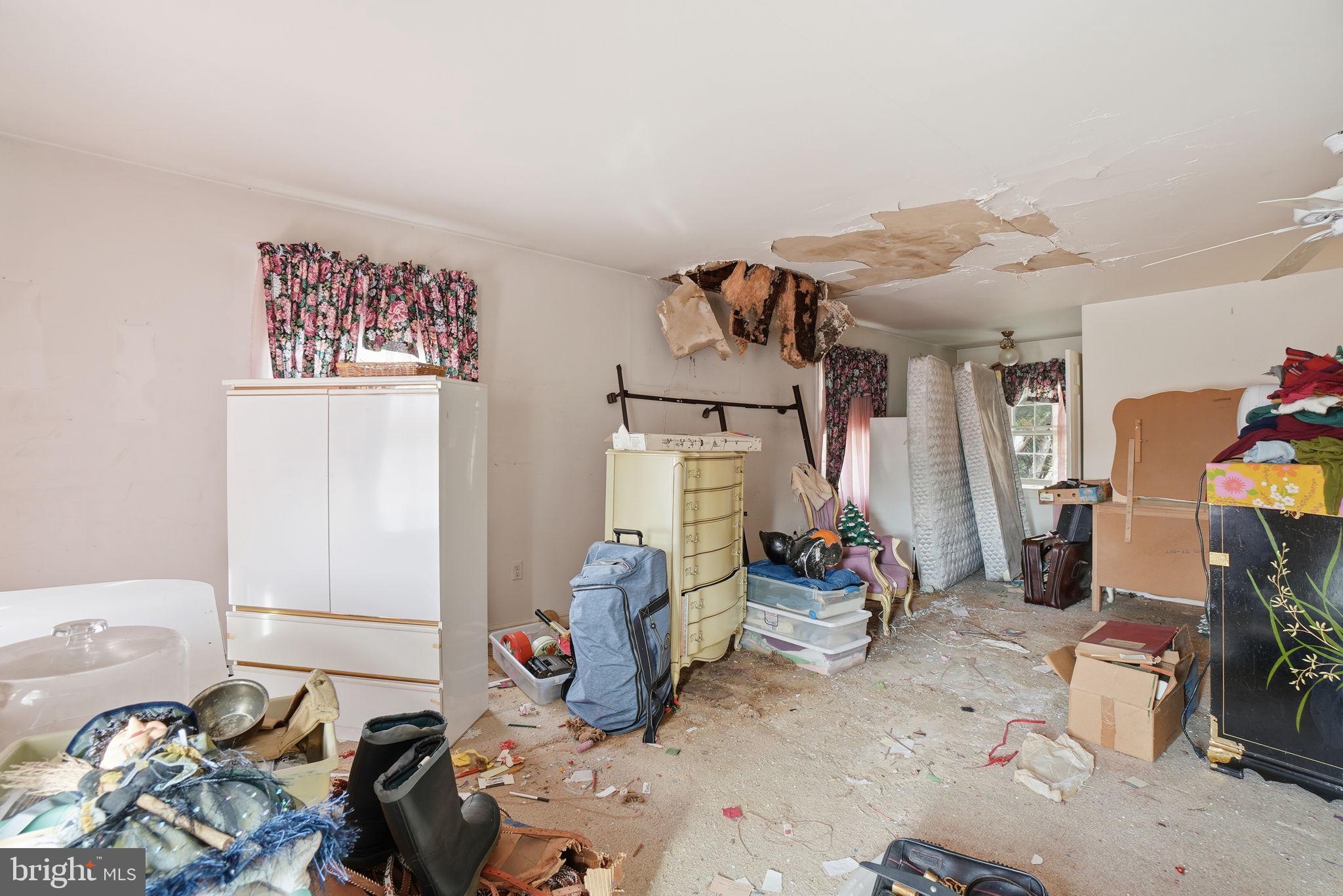 1430 Foxhall Road Northwest Washington, DC 20007 - Photo 16 of 53 a bedroom with furniture and a fan