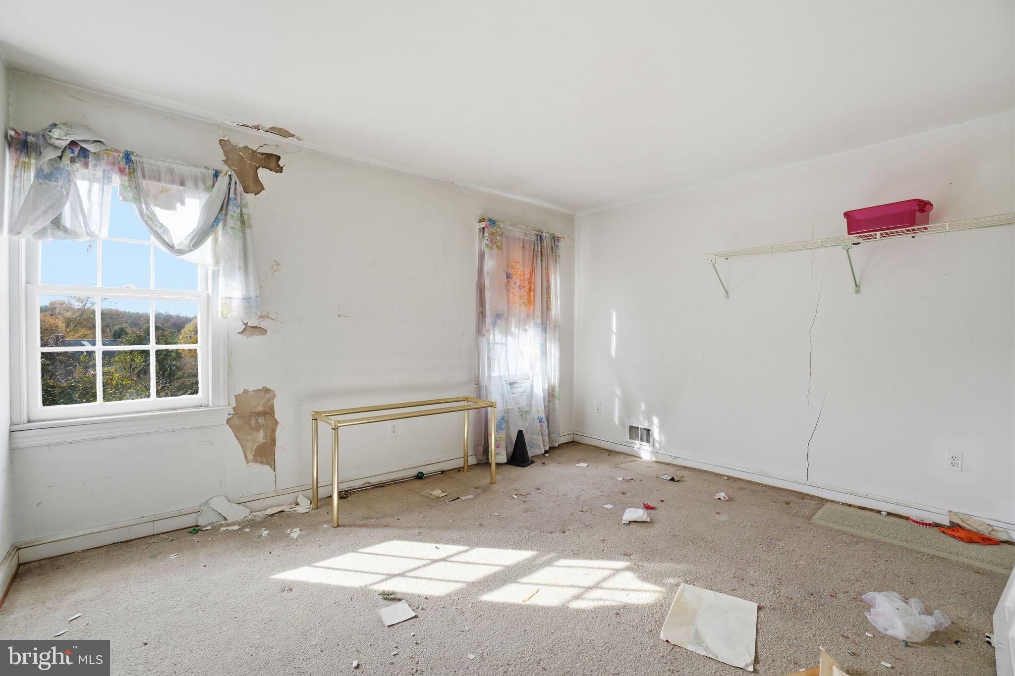 1430 Foxhall Road Northwest Washington, DC 20007 - Photo 17 of 53 a view of a livingroom with furniture and window