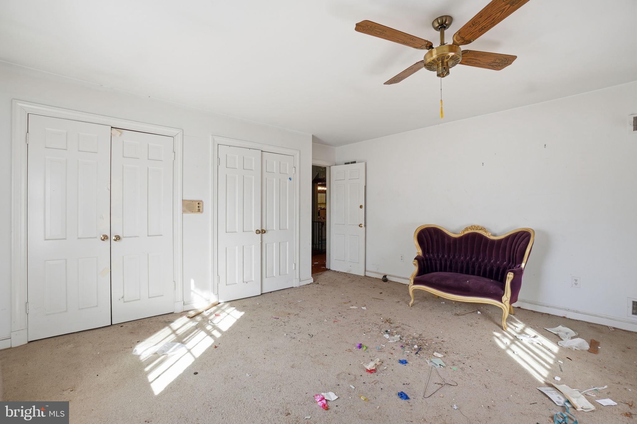 1430 Foxhall Road Northwest Washington, DC 20007 - Photo 20 of 53 a view of a livingroom with furniture and a ceiling fan