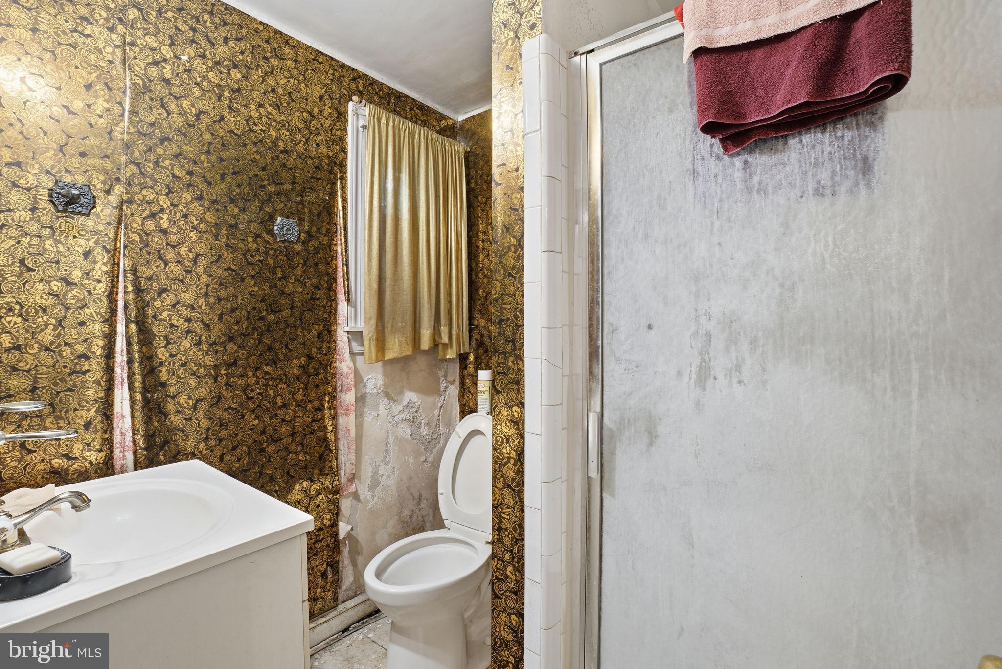 1430 Foxhall Road Northwest Washington, DC 20007 - Photo 28 of 53 a bathroom with a sink toilet and shower