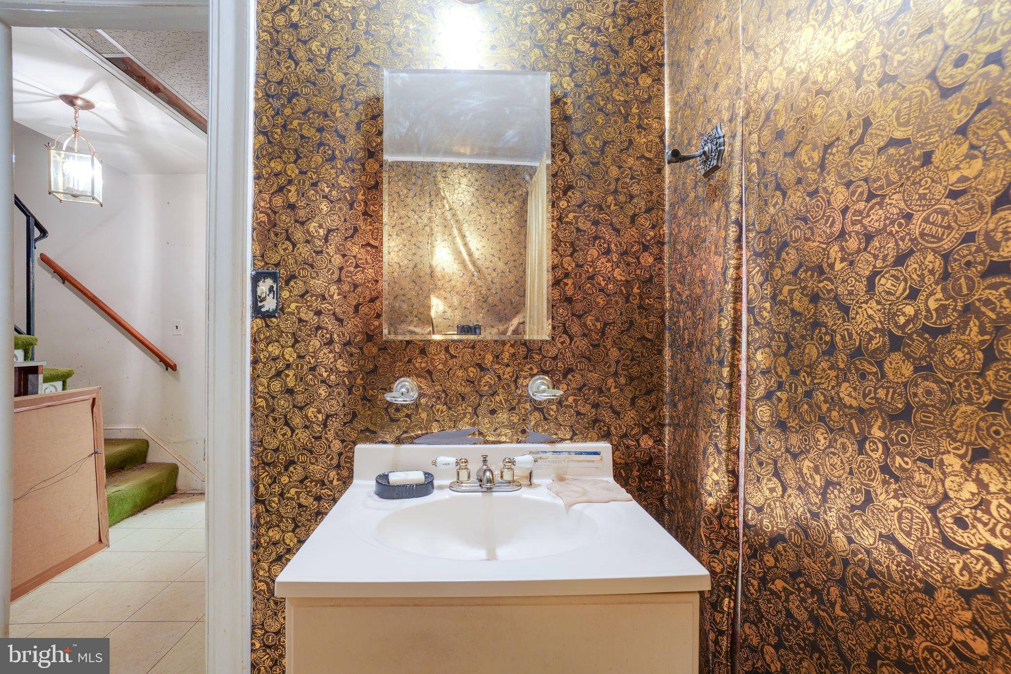 1430 Foxhall Road Northwest Washington, DC 20007 - Photo 29 of 53 a bathroom with a sink and mirror