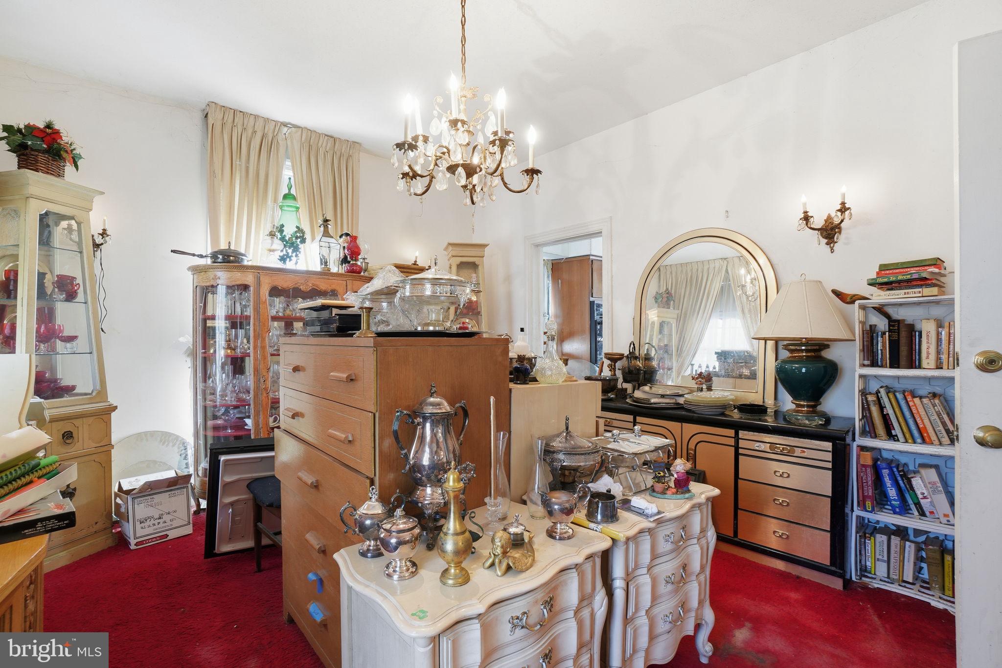 1430 Foxhall Road Northwest Washington, DC 20007 - Photo 6 of 53 a living room with furniture and a book shelf