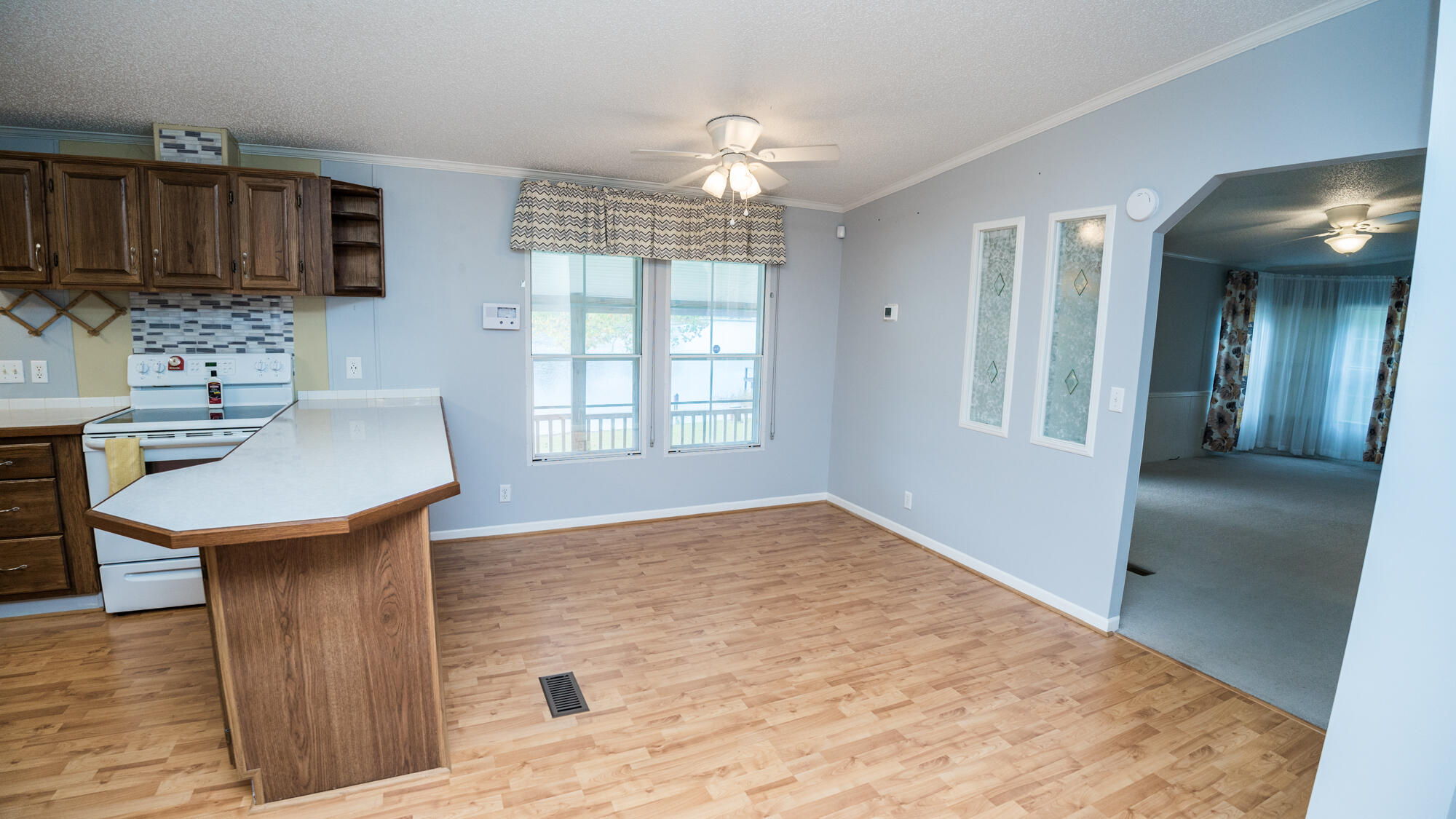 125 Red Eye Road DeFuniak Springs, FL 32433 - Photo 11 of 50 a kitchen with stainless steel appliances granite countertop a sink stove and refrigerator