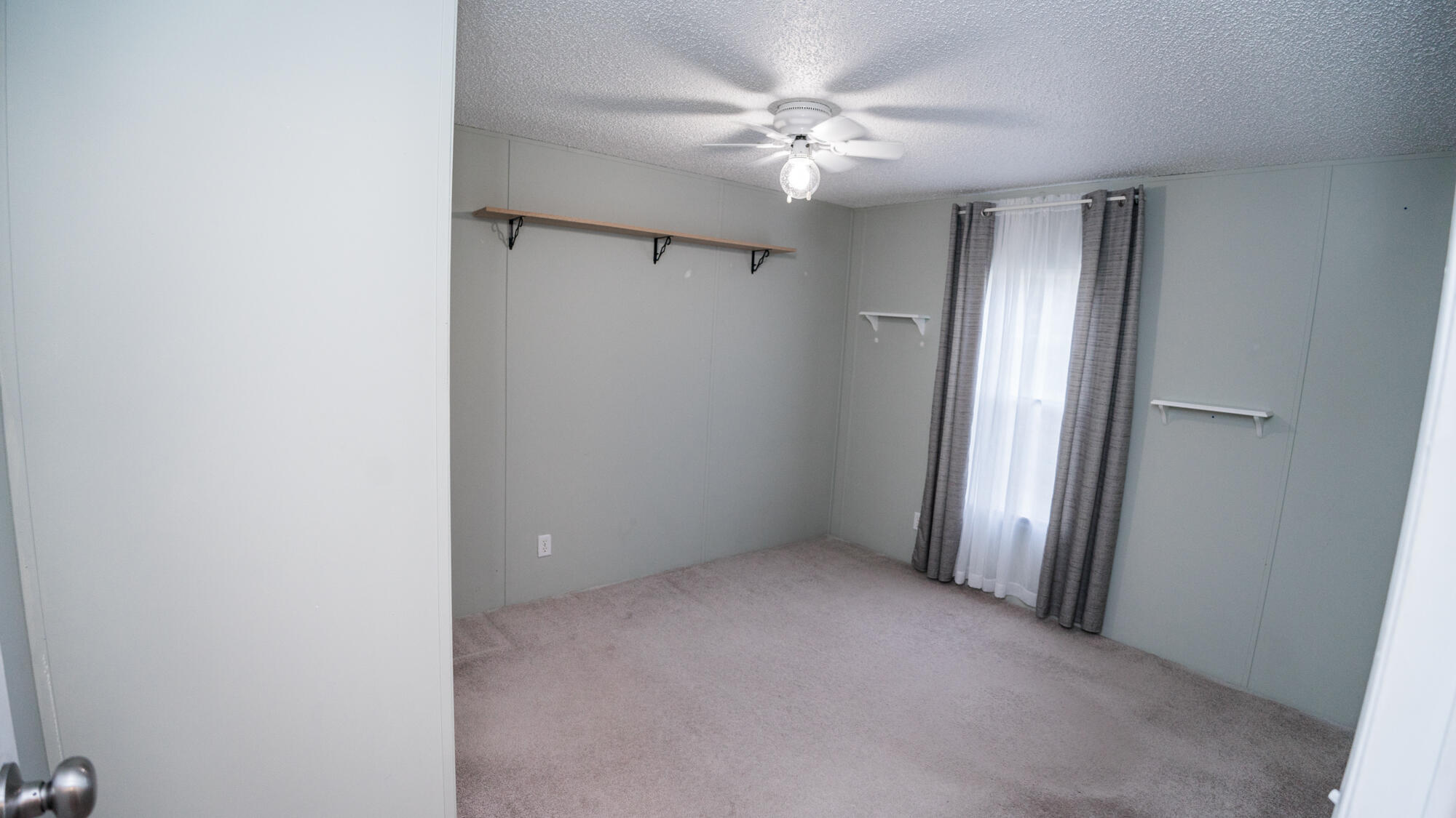 125 Red Eye Road DeFuniak Springs, FL 32433 - Photo 21 of 50 a view of an empty room with a window