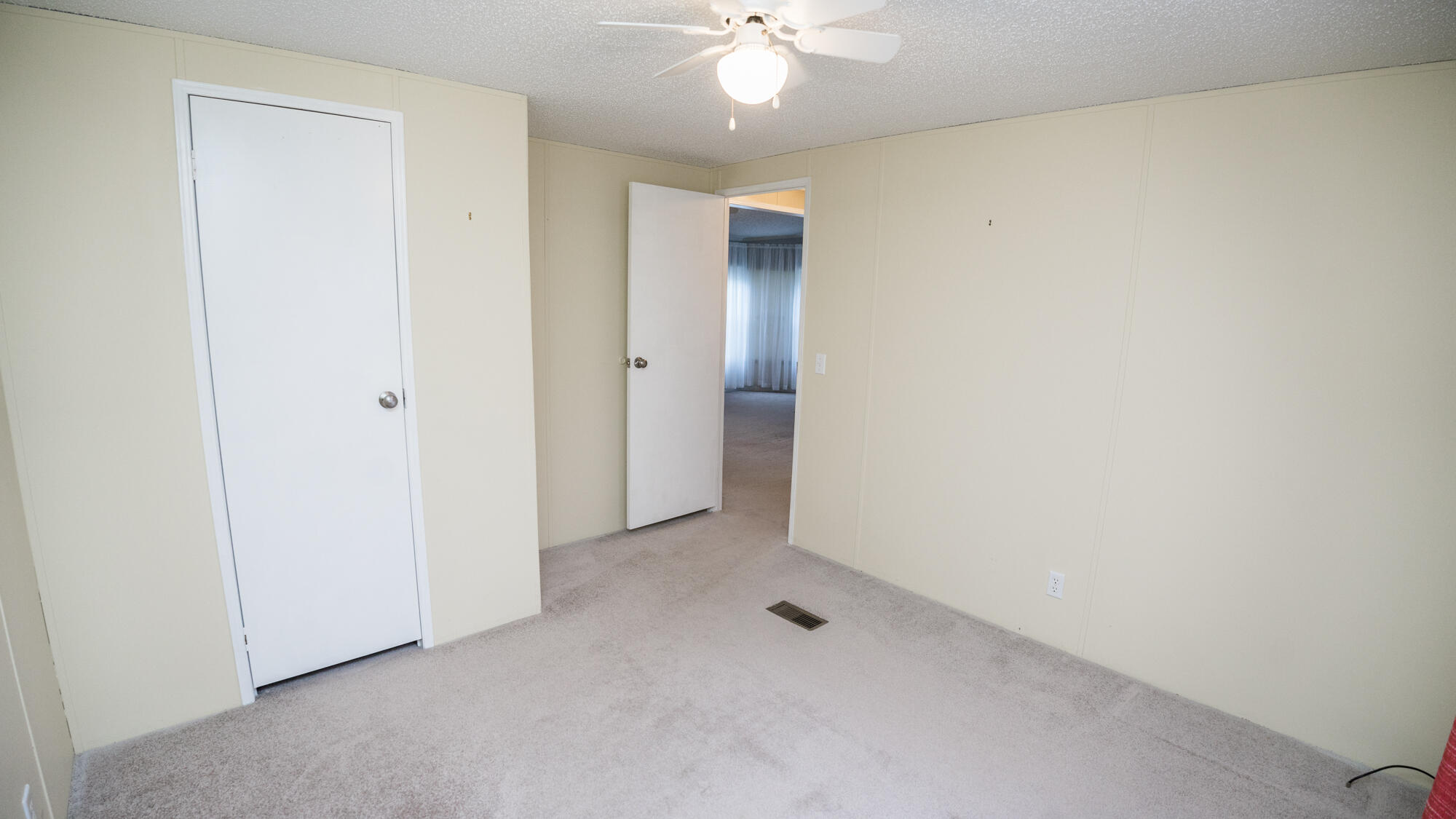 125 Red Eye Road DeFuniak Springs, FL 32433 - Photo 25 of 50 an empty room with a chandelier fan and closet