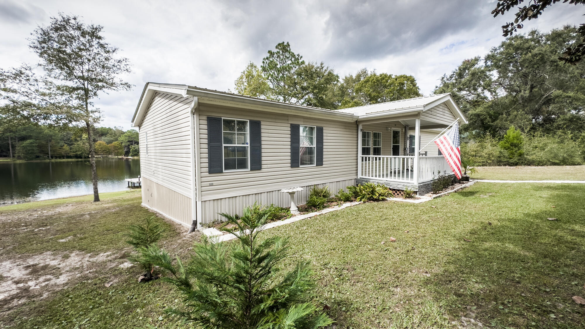 125 Red Eye Road DeFuniak Springs, FL 32433 - Photo 33 of 50 a view of a house with a yard