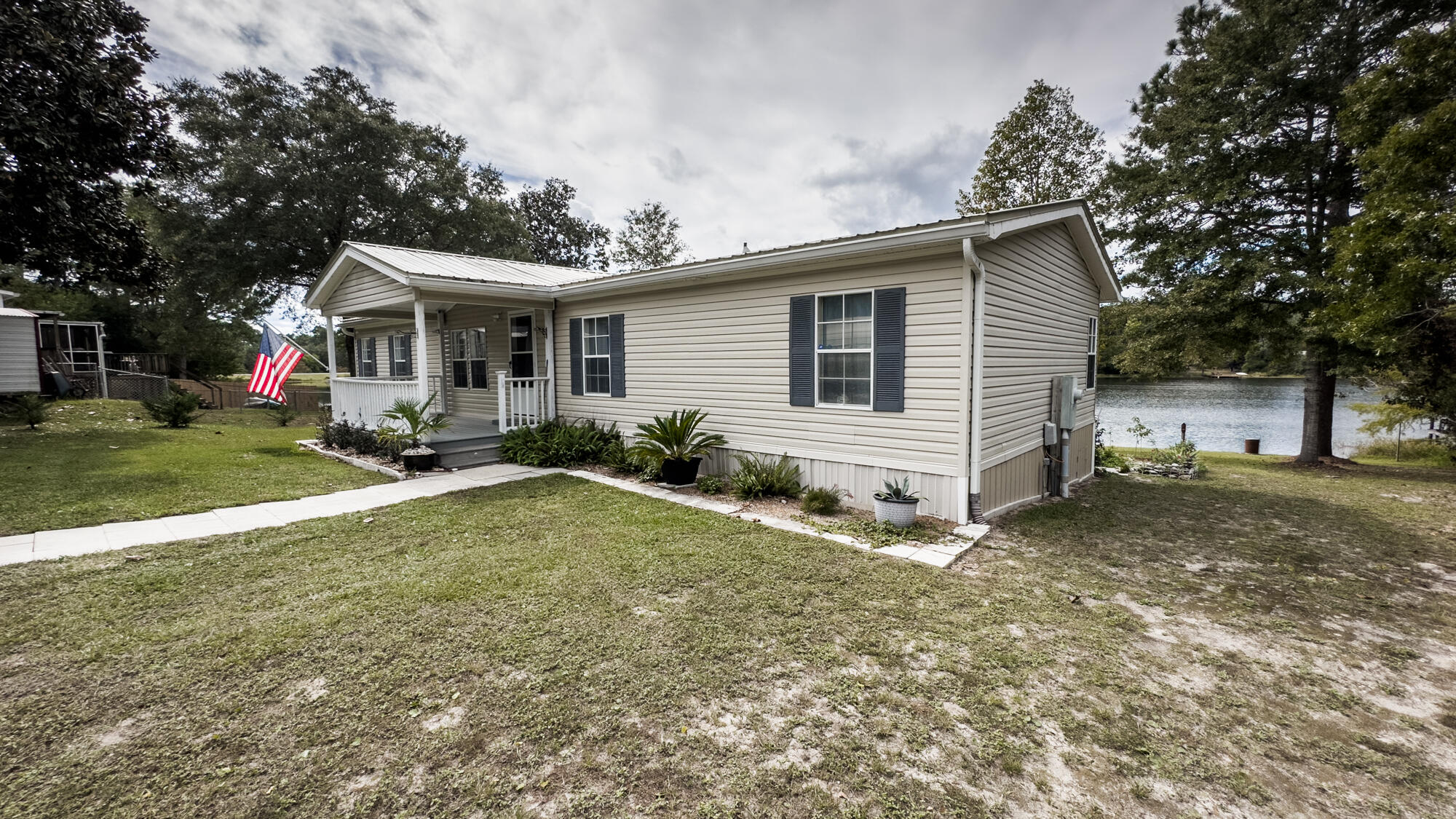 125 Red Eye Road DeFuniak Springs, FL 32433 - Photo 34 of 50 a view of a house with a yard