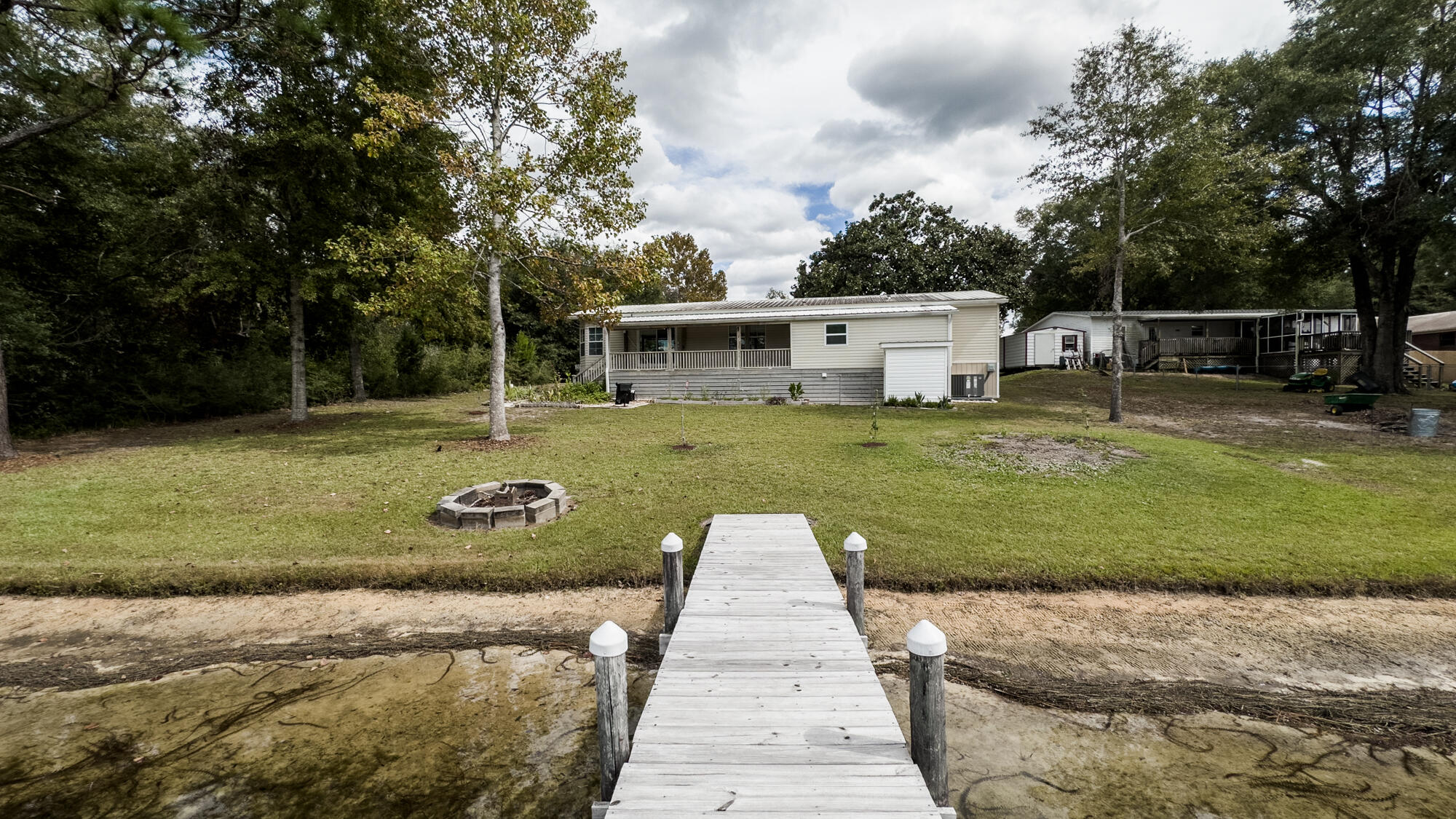 125 Red Eye Road DeFuniak Springs, FL 32433 - Photo 39 of 50 a front view of a house with garden