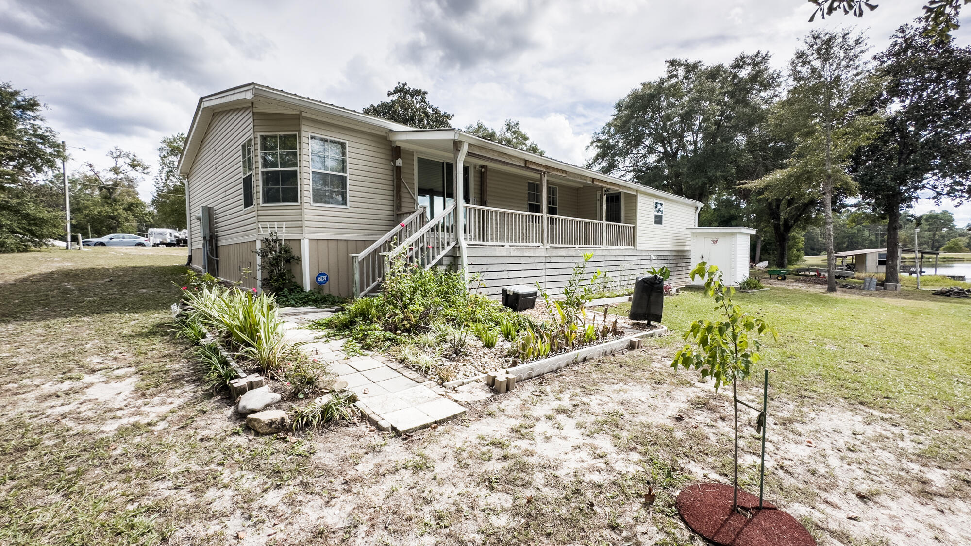 125 Red Eye Road DeFuniak Springs, FL 32433 - Photo 40 of 50 a front view of a house with a yard