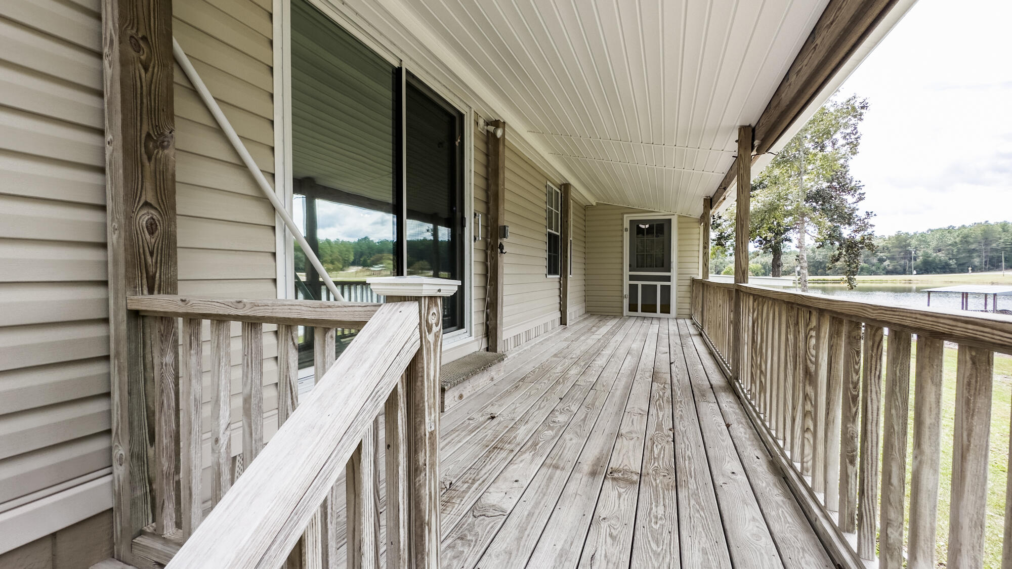 125 Red Eye Road DeFuniak Springs, FL 32433 - Photo 43 of 50 a view of balcony with wooden floor and fence
