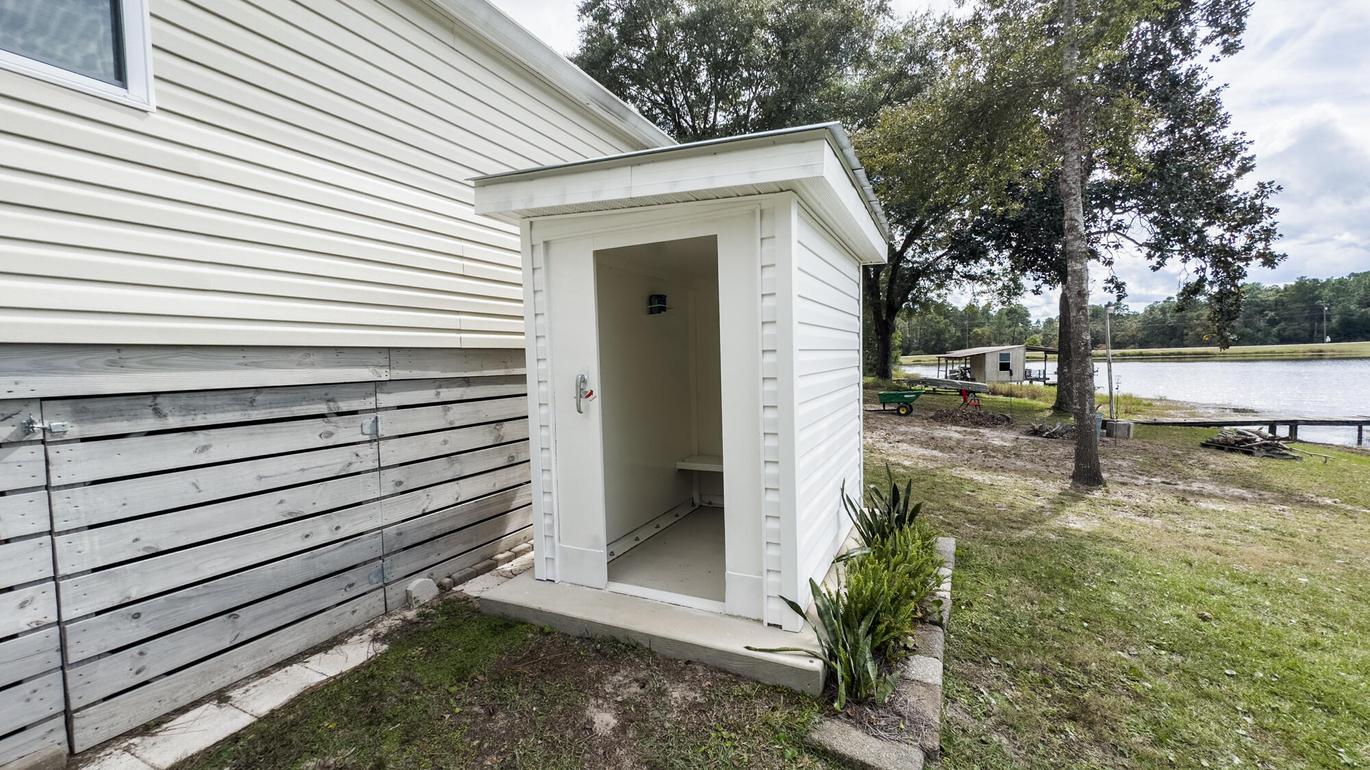125 Red Eye Road DeFuniak Springs, FL 32433 - Photo 46 of 50 a view of a small house with backyard