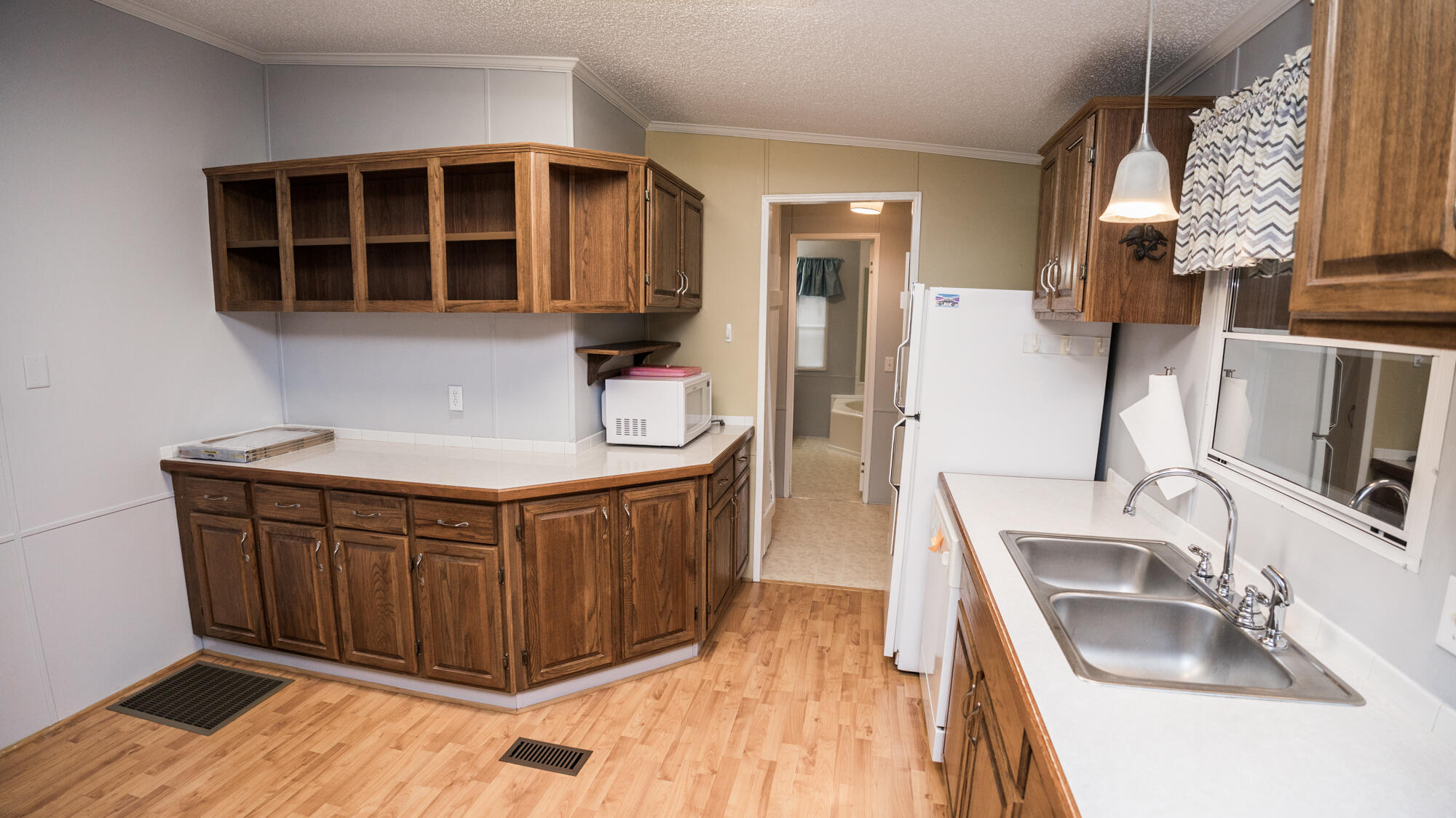 125 Red Eye Road DeFuniak Springs, FL 32433 - Photo 7 of 50 a kitchen with stainless steel appliances granite countertop a sink dishwasher stove and cabinets
