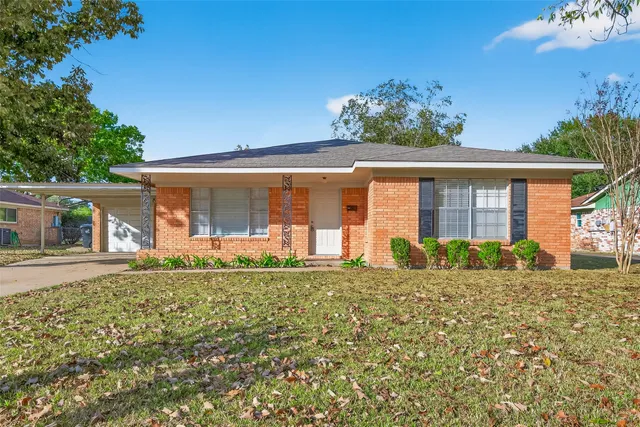 front view of a house with a large window