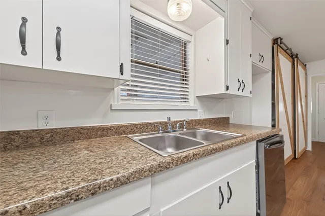 a kitchen with granite countertop a sink and a granite counter tops