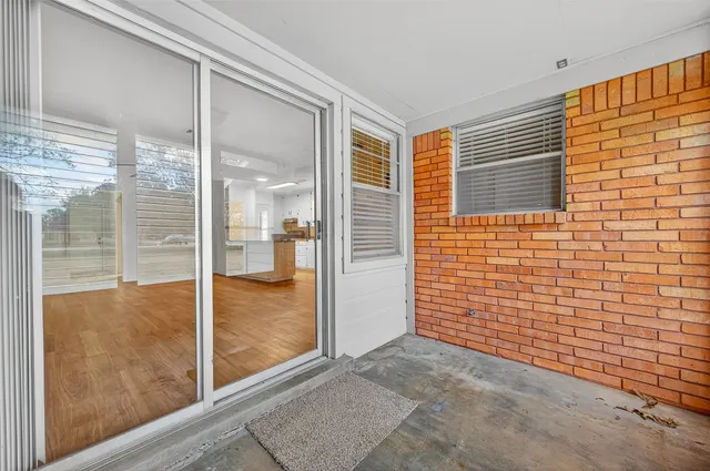 a view of a bathroom with a glass door