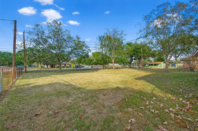 a view of a golf course with a lake view