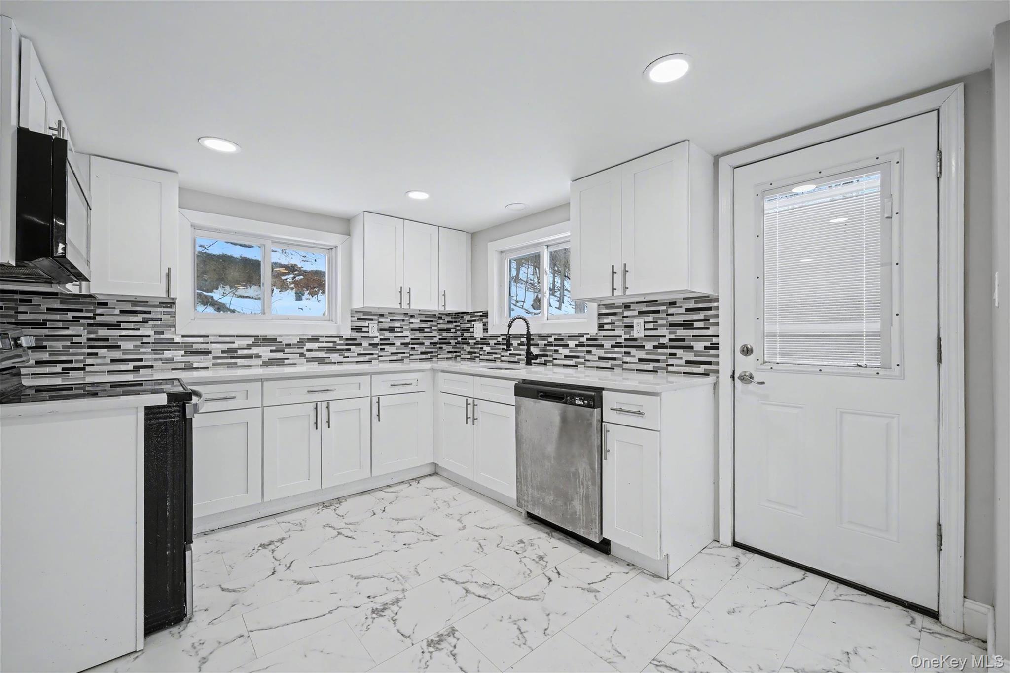 108 Pine Hill Road Chester, NY 10918 - Photo 13 of 37 a kitchen with granite countertop white cabinets and stainless steel appliances