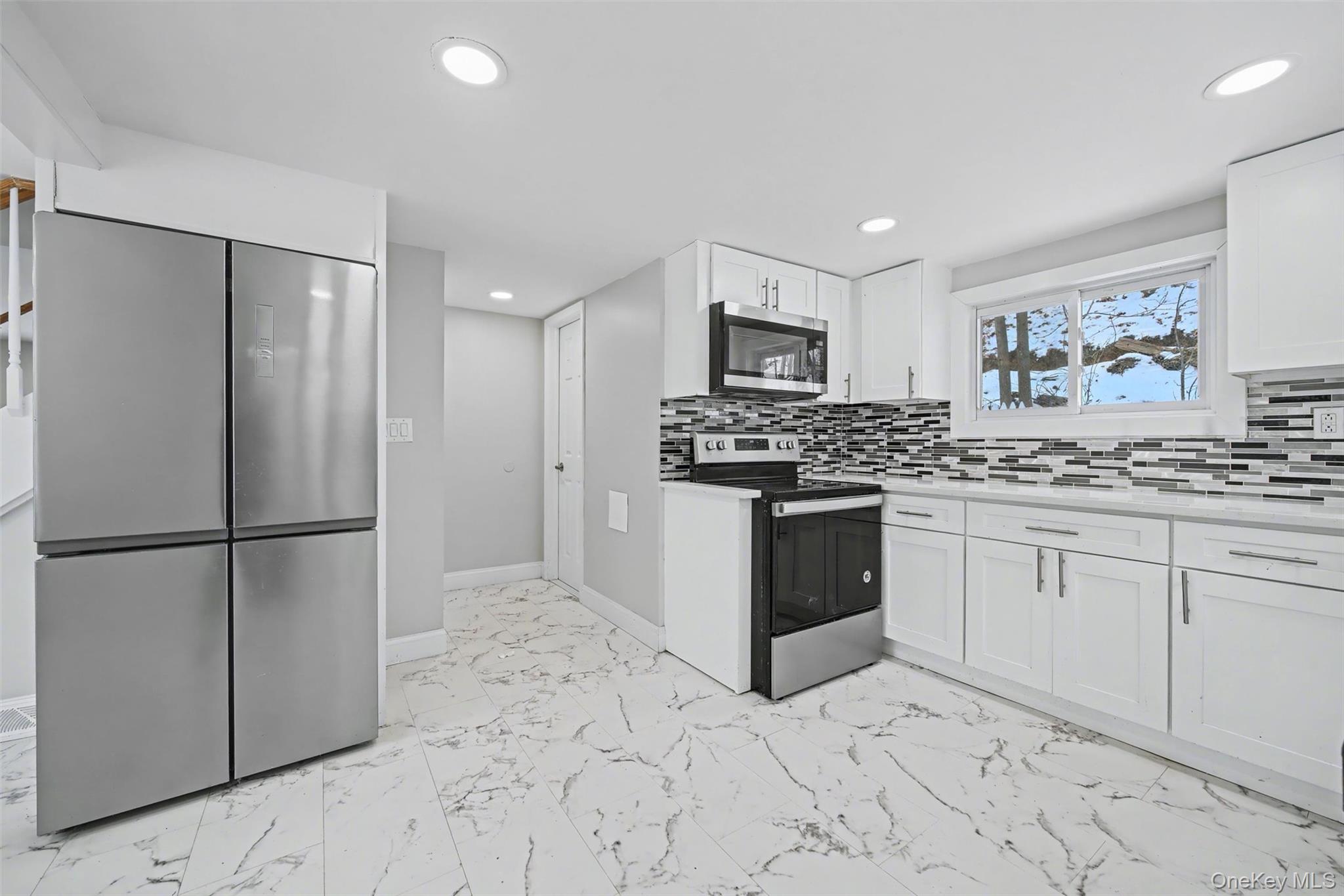 108 Pine Hill Road Chester, NY 10918 - Photo 14 of 37 a kitchen with stainless steel appliances a refrigerator sink and microwave