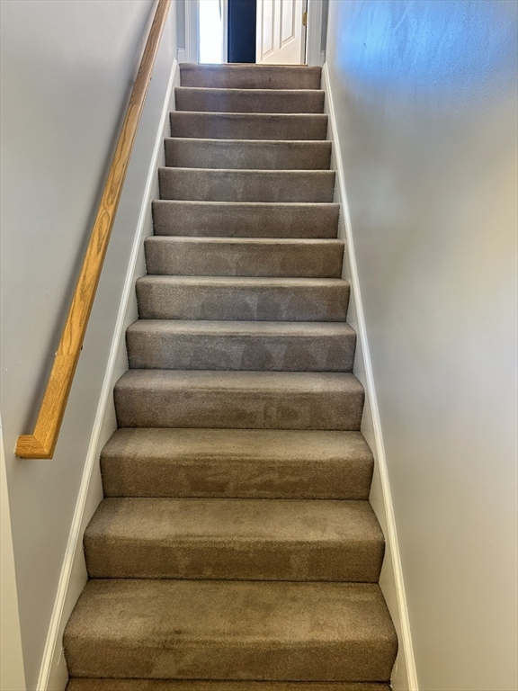 1975 Middlesex Street, Unit 10 Lowell, MA 01851 - Photo 21 of 21 a view of staircase with white walls