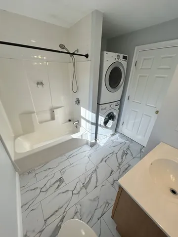 a bathroom with a sink and a washing machine