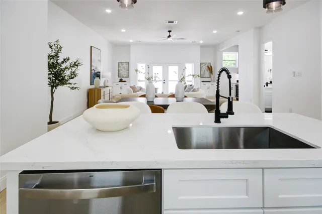 a kitchen with a refrigerator and a sink