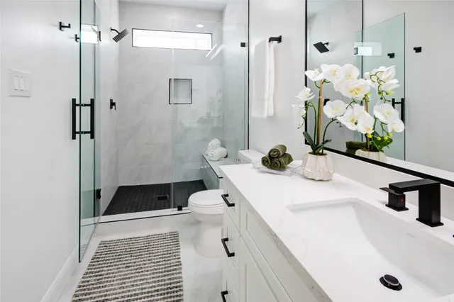 a bathroom with a sink and a shower