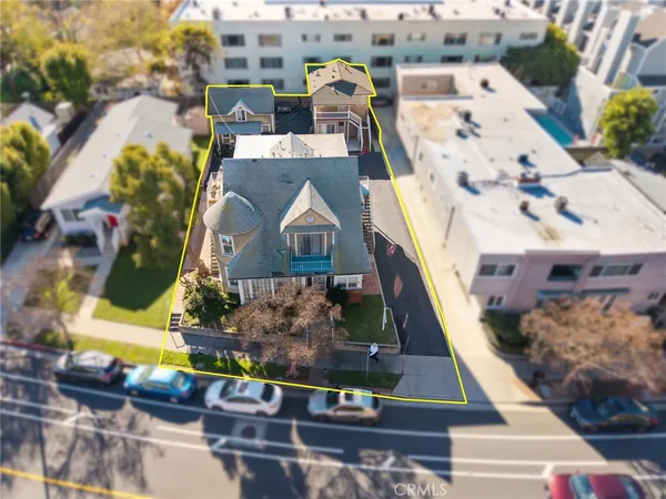 an aerial view of a house with a yard