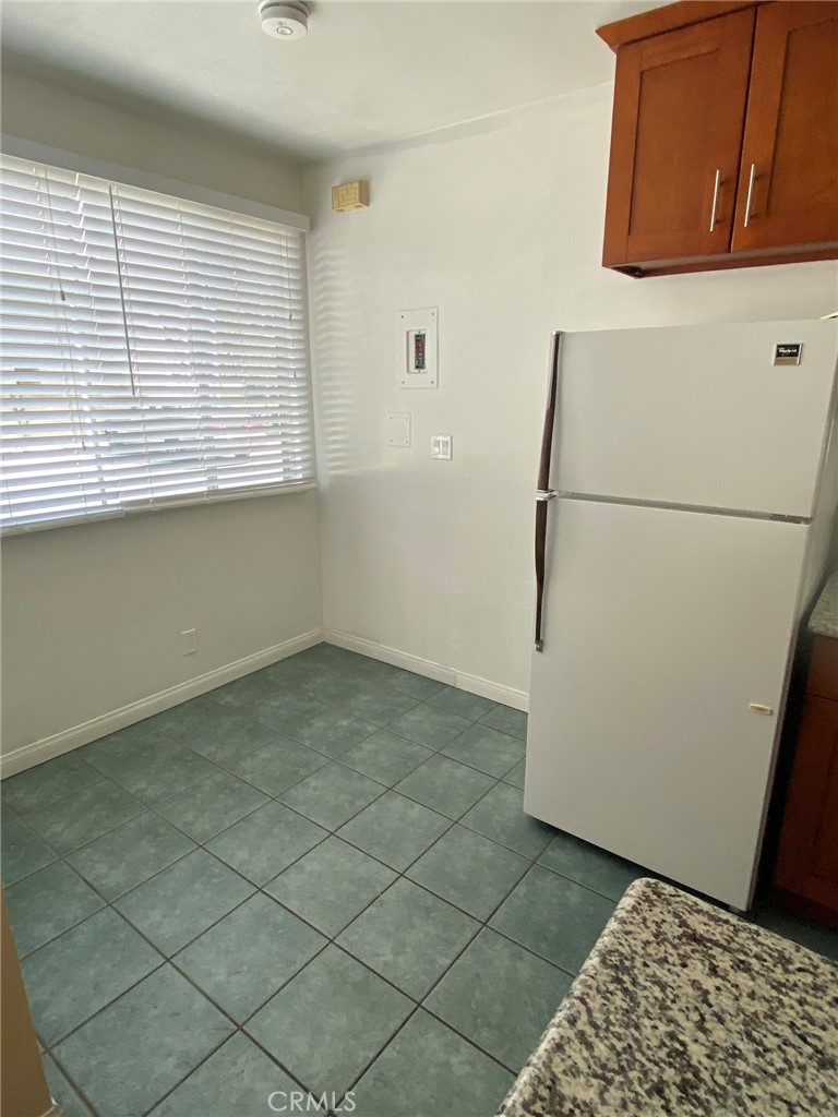 1124 Cordova Street, Unit 1 Pasadena, CA 91106 - Photo 3 of 8 a view of a refrigerator in kitchen and a window