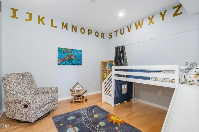 a bathroom with a bathtub shower sink mirror vanity and toilet