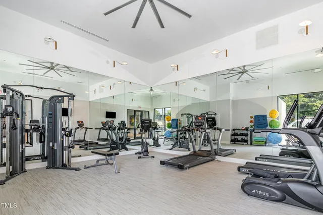 a view of a terrace with furniture and city view