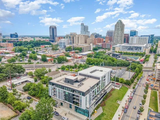 a view of a balcony with an outdoor seating