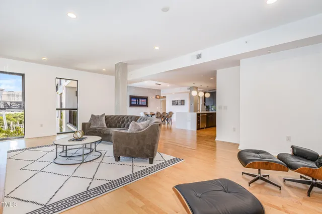a living room with furniture and a table