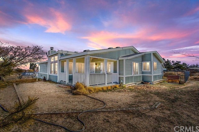 5523 Solano Road Phelan, CA 92371 - Photo 1 of 1 a view of a house with a patio