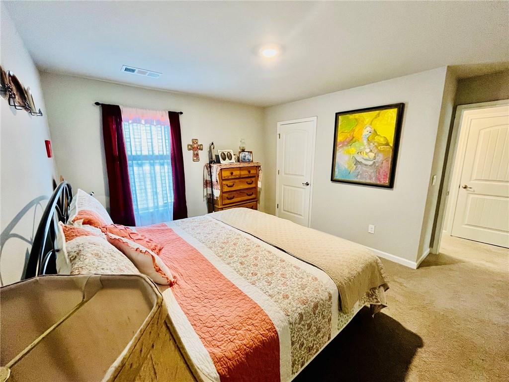 3015 Winding Ridge Waleska, GA 30183 - Photo 27 of 40 a bedroom with bed and a window