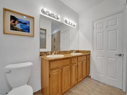 a bathroom with a shower and a sink