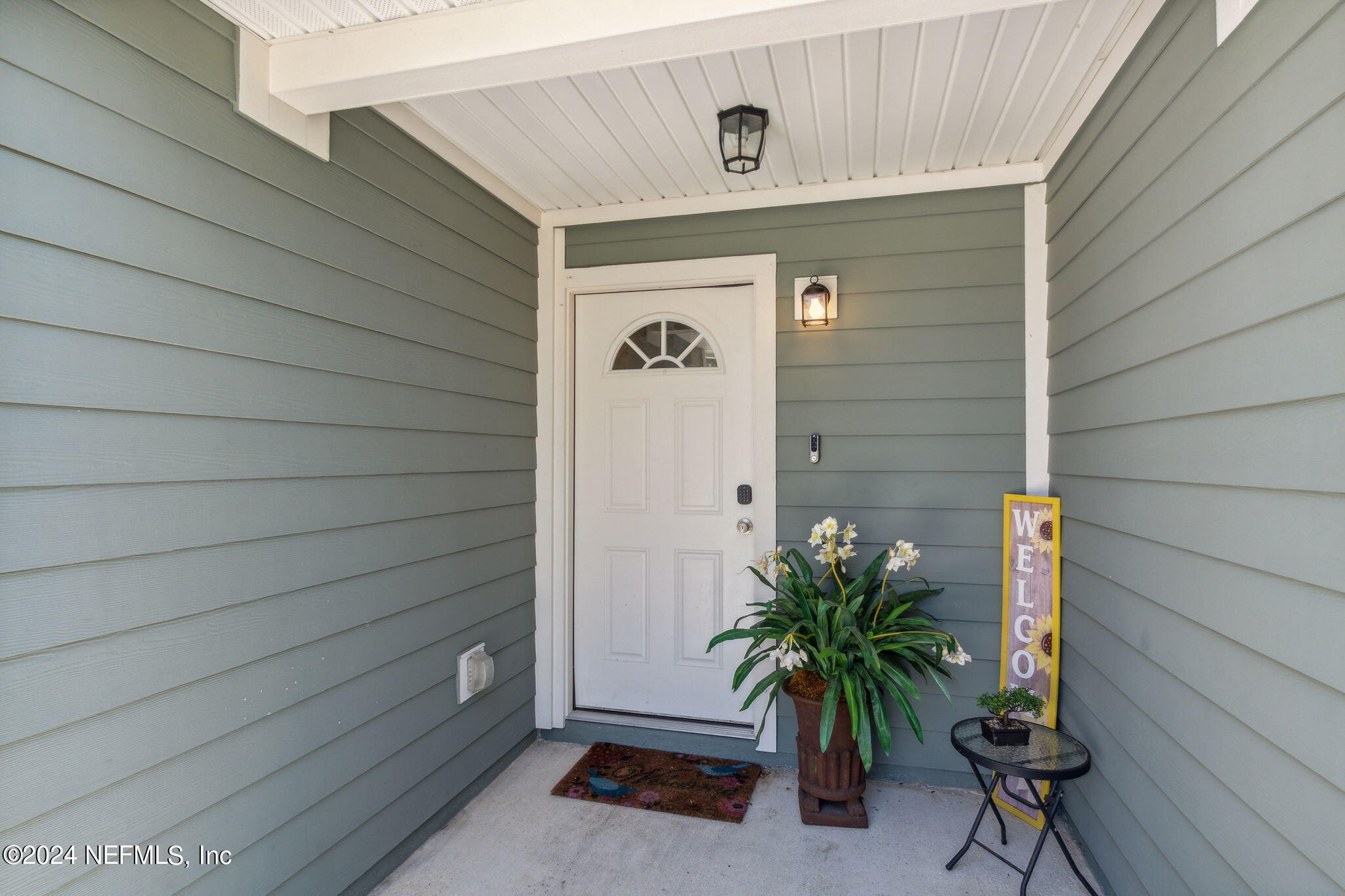 8516 April Street Jacksonville, FL 32244 - Photo 3 of 26 a view of front door and potted plants