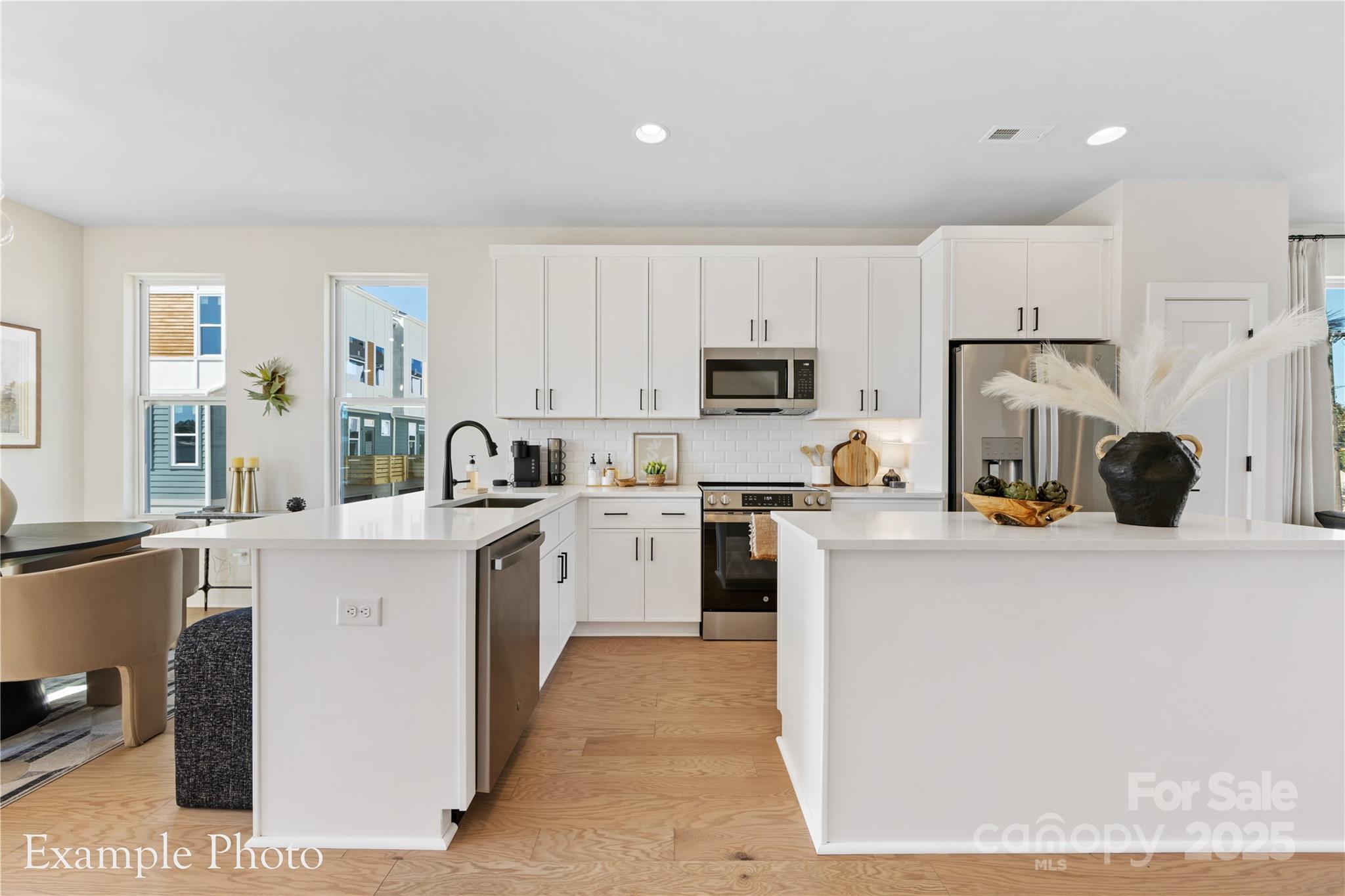 548 Rountree Road, Unit 9 Charlotte, NC 28217 - Photo 13 of 36 a kitchen with cabinets a sink and white appliances