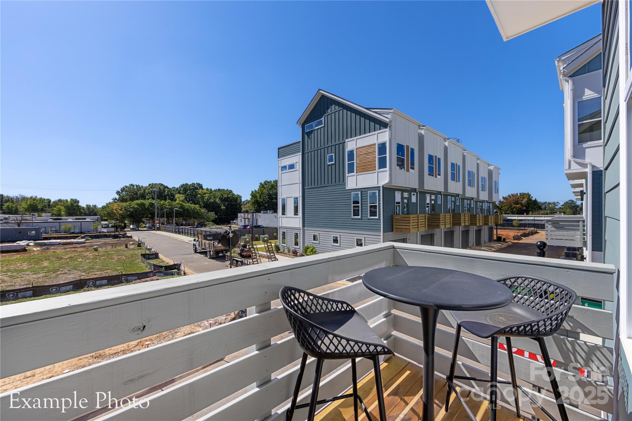 548 Rountree Road, Unit 9 Charlotte, NC 28217 - Photo 18 of 36 a view of a patio with dining table and chairs with wooden floor