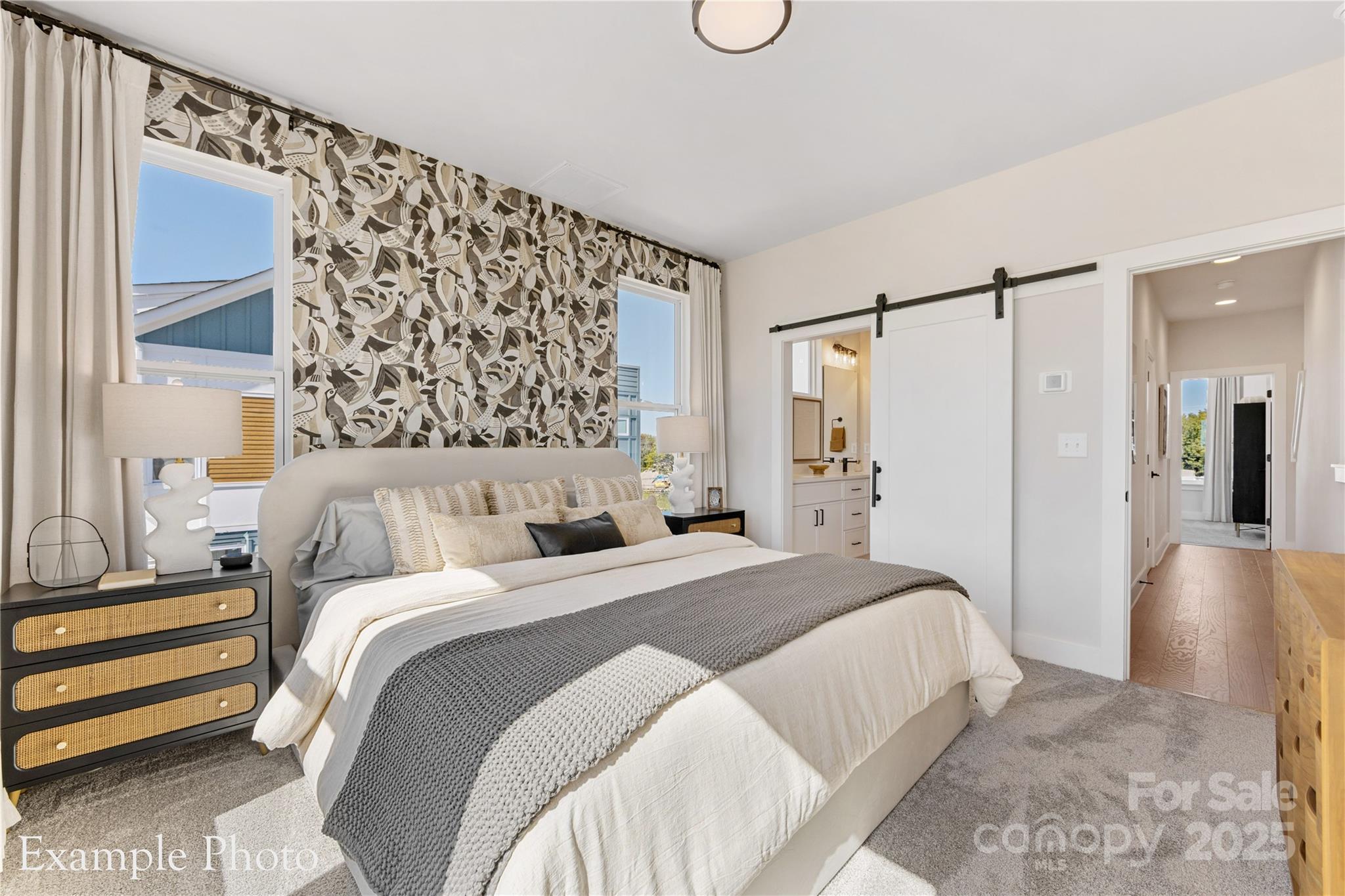 548 Rountree Road, Unit 9 Charlotte, NC 28217 - Photo 22 of 36 a bedroom with a bed and a walk in closet